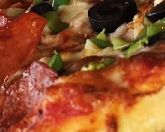 Wood-oven pizza with pepperoni, olives and peppers