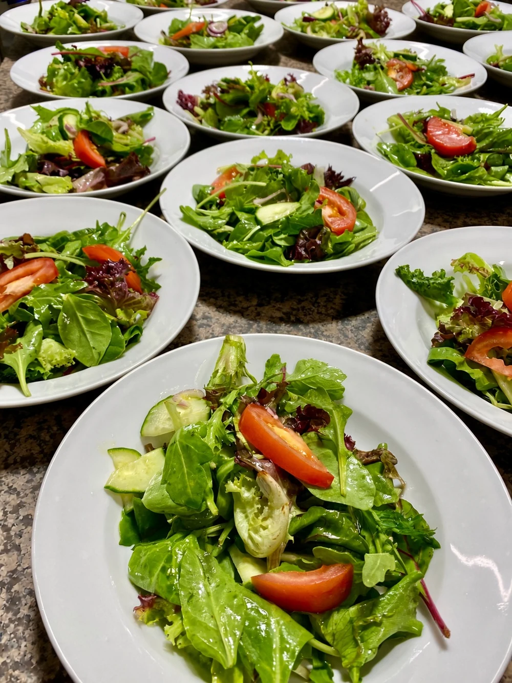 Fresh salad plates prepared for a catered event